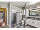 Modern bathroom with walk-in shower, hexagon floor tile and a contemporary vanity at 249 Sportsman Rd, Rotonda West, FL 33947