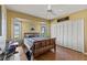 Bright bedroom with wood floors, a ceiling fan and built-in closet at 249 Sportsman Rd, Rotonda West, FL 33947