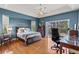 Bright bedroom with hardwood floors, a ceiling fan and pool view at 249 Sportsman Rd, Rotonda West, FL 33947