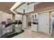 Bright kitchen with granite countertops and stainless steel appliances at 249 Sportsman Rd, Rotonda West, FL 33947