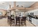 Eat-in kitchen boasts stainless steel appliances and a breakfast bar at 249 Sportsman Rd, Rotonda West, FL 33947
