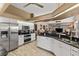 Modern kitchen features stainless steel appliances and ample cabinetry at 249 Sportsman Rd, Rotonda West, FL 33947