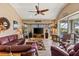 Spacious living room with comfortable seating and large windows at 249 Sportsman Rd, Rotonda West, FL 33947