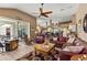 Relaxing living room featuring comfortable leather furniture and a large TV at 249 Sportsman Rd, Rotonda West, FL 33947