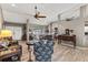 Spacious living room with a ceiling fan, hardwood floors, and comfortable seating at 249 Sportsman Rd, Rotonda West, FL 33947