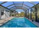 Enjoy this refreshing pool with screened enclosure and tranquil setting at 249 Sportsman Rd, Rotonda West, FL 33947