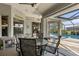 Relaxing poolside patio with table and chairs, offering tranquil views at 249 Sportsman Rd, Rotonda West, FL 33947