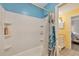 Bathroom with a shower/tub combo and blue walls at 255 Boundary Blvd # 104, Rotonda West, FL 33947