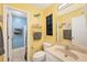 Bathroom with single sink vanity, toilet and shower/tub combo at 255 Boundary Blvd # 104, Rotonda West, FL 33947
