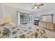 Bedroom with palm tree bedding, dresser, and a window seat at 255 Boundary Blvd # 104, Rotonda West, FL 33947