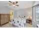 Guest bedroom with palm tree bedding and a dresser at 255 Boundary Blvd # 104, Rotonda West, FL 33947