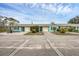 Houses with teal exterior and attached garages, aerial view at 255 Boundary Blvd # 104, Rotonda West, FL 33947