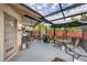 Relaxing screened porch with seating and a grill at 255 Boundary Blvd # 104, Rotonda West, FL 33947