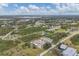 Aerial view of the neighborhood, highlighting the subject property's location at 255 Boundary Blvd # 105, Rotonda West, FL 33947