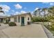 Private backyard oasis with patio and exterior access at 255 Boundary Blvd # 105, Rotonda West, FL 33947