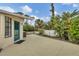 Spacious backyard with patio and lush tropical landscaping at 255 Boundary Blvd # 105, Rotonda West, FL 33947