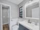 Updated bathroom with a vanity and a walk-in shower at 255 Boundary Blvd # 105, Rotonda West, FL 33947