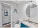 Updated bathroom with teal vanity, shiplap walls, and walk-in shower at 255 Boundary Blvd # 105, Rotonda West, FL 33947