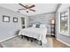 Cozy bedroom with wood-look floors and a ceiling fan at 255 Boundary Blvd # 105, Rotonda West, FL 33947