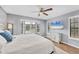 Main bedroom with wood-look floors and large windows at 255 Boundary Blvd # 105, Rotonda West, FL 33947