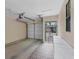 Attached garage with storage cabinets and access to backyard at 255 Boundary Blvd # 105, Rotonda West, FL 33947