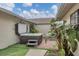 Private hot tub with tropical landscaping and tiled patio at 255 Boundary Blvd # 105, Rotonda West, FL 33947