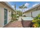 Hot tub with surrounding tropical landscaping and patio at 255 Boundary Blvd # 105, Rotonda West, FL 33947