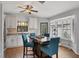 Modern kitchen featuring white cabinets, granite counters, and a breakfast bar at 255 Boundary Blvd # 105, Rotonda West, FL 33947
