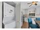 Compact laundry room with stackable washer and dryer, and kitchen view at 255 Boundary Blvd # 105, Rotonda West, FL 33947