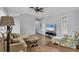 Spacious living room with a comfy sectional and wood-look flooring at 255 Boundary Blvd # 105, Rotonda West, FL 33947