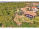 Aerial view of home with private pool and lush landscaping at 2888 Myakka Creek Ct., Port Charlotte, FL 33953