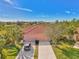 Aerial view of two-story home with two-car garage and driveway at 2888 Myakka Creek Ct., Port Charlotte, FL 33953