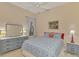 Bedroom with a blue bedspread and ceiling fan at 2888 Myakka Creek Ct., Port Charlotte, FL 33953