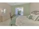 Light and airy bedroom with a bed, dresser and window at 2888 Myakka Creek Ct., Port Charlotte, FL 33953