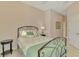 Bedroom with a metal bed frame, nightstand and closet at 2888 Myakka Creek Ct., Port Charlotte, FL 33953