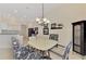 Breakfast nook with table and chairs, adjacent to kitchen at 2888 Myakka Creek Ct., Port Charlotte, FL 33953