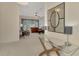 Entryway with view into living room, glass-top console table and mirror at 2888 Myakka Creek Ct., Port Charlotte, FL 33953