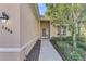 House entrance with walkway, landscaping, and a light fixture at 2888 Myakka Creek Ct., Port Charlotte, FL 33953