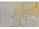 Laundry room with washer, dryer, and shelving at 2888 Myakka Creek Ct., Port Charlotte, FL 33953