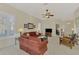 Living room with sectional sofa, TV, and access to entryway at 2888 Myakka Creek Ct., Port Charlotte, FL 33953