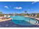 Freeform swimming pool with plenty of lounge chairs and a spacious deck at 305 Daylily Blvd, Nokomis, FL 34275