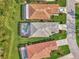 Aerial view of two homes with pools and screened lanais at 3283 Osprey Ln, Port Charlotte, FL 33953