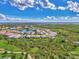 Aerial view of community with waterfront access and lush landscape at 3283 Osprey Ln, Port Charlotte, FL 33953