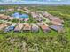 Aerial view showcasing a home with a pool in a residential community at 3283 Osprey Ln, Port Charlotte, FL 33953