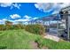 Landscaped backyard with lush lawn and screened patio at 3283 Osprey Ln, Port Charlotte, FL 33953