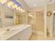 Bathroom boasts double vanity and walk-in shower at 3283 Osprey Ln, Port Charlotte, FL 33953