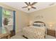 Cozy bedroom with ceiling fan and window at 3283 Osprey Ln, Port Charlotte, FL 33953