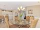 Dining area with glass table, wicker chairs, and kitchen views at 3283 Osprey Ln, Port Charlotte, FL 33953