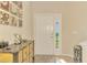 Bright entryway with white door, decorative console table, and artwork at 3283 Osprey Ln, Port Charlotte, FL 33953