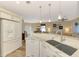 Modern kitchen with white cabinets, marble countertops, and stainless steel appliances at 3283 Osprey Ln, Port Charlotte, FL 33953